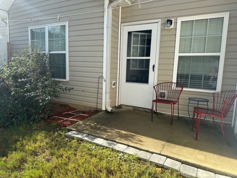 Back patio with fenced in backyard (electric grill in garage)