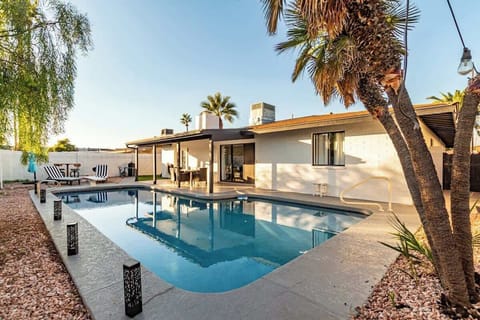 Refreshing diving pool with sunny outdoor seating.