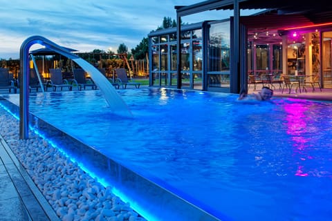 Outdoor pool, open 7:00 AM to 10:00 PM, pool umbrellas, sun loungers
