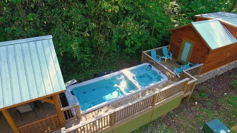 Bryce and it's neighboring cabin, River share a swim spa and hot tub.