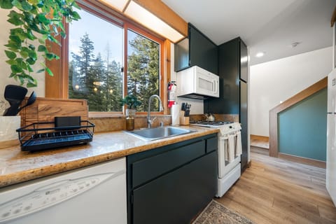 A large basin sink and dishwasher makes cleaning up a breeze