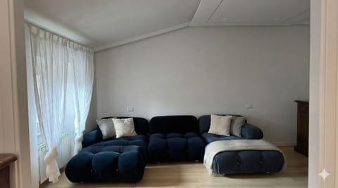 Deluxe Apartment, City View | Living area | 65-inch Smart TV with digital channels