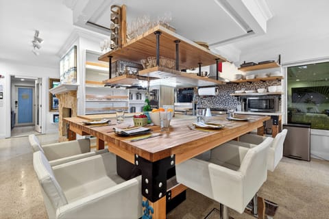 Open-concept kitchen with custom island seating and modern finishes.