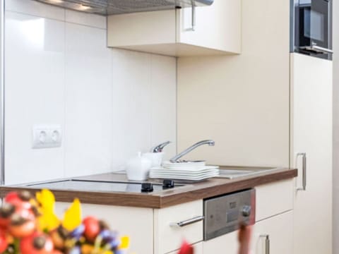 Kitchen, Countertop, Kitchen Appliance, Interior Design, Cabinetry, Wood, Furniture, Flooring, Home Appliance, Room