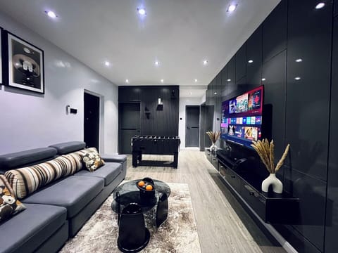 Economy Apartment, Balcony, City View | Living area | Flat-screen TV