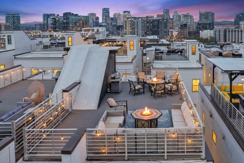Fire lit. Skyline glowing. No one checking the time.

