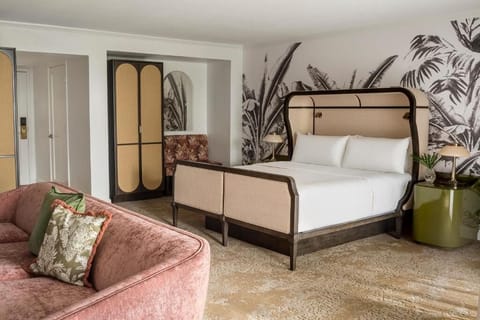 Recharge in a serene king room with statement headboard design.