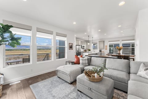 The Nordic Dream living room has a large sectional and unobstructed views of the Wasatch Back