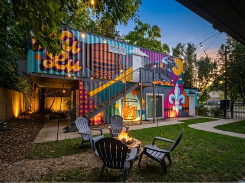 Gather around the fire pit for cozy evenings under the twinkling string lights.