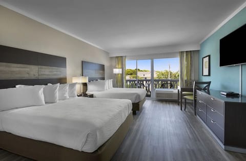 Stretch out in airy comfort with two plush queen beds.