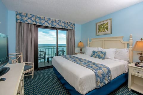 Wake up to ocean breezes from this bright king bedroom.
