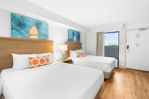 Stretch out across two plush beds after beach days.
