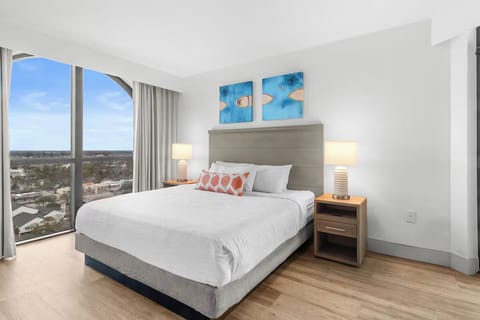 Wake up to sunlit comfort and sweeping skyline views.