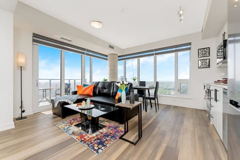 Bright Open-Concept Living And Dining Area With Stunning Floor-To-Ceiling Windows