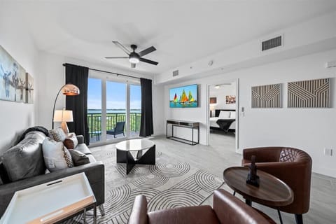 Modern living room with balcony access and natural light