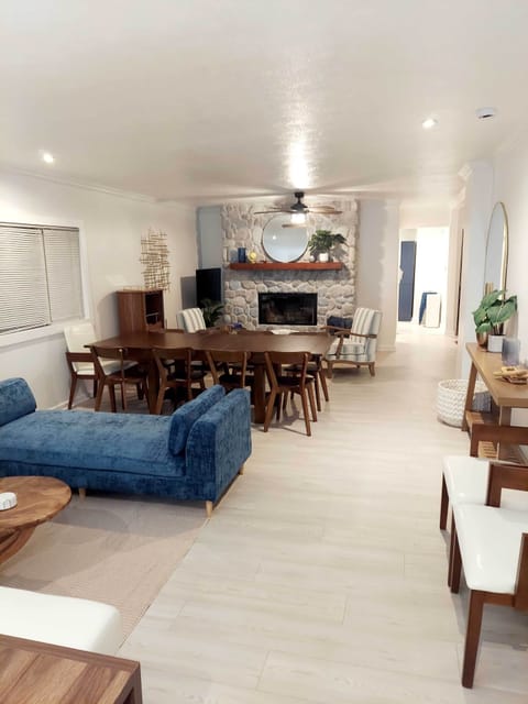 Expansive living room with dining. Multiple areas to gather and relax. Dining seats up to 16.