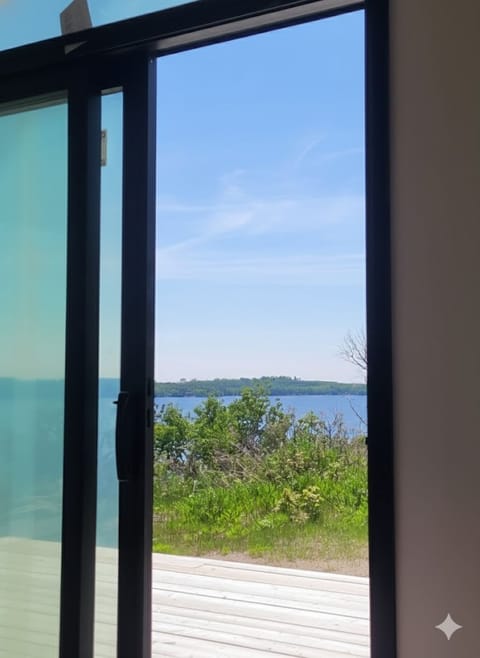 Sliding doors open to the deck with elevated views of Lake Vermilion.