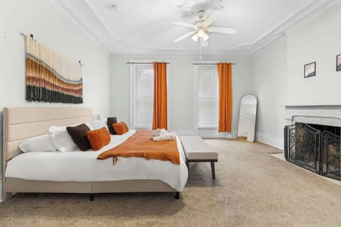 Beautifully designed modern King-bed bedroom with a cozy fireplace, hotel-quality linens, and an open, airy layout for a peaceful night’s rest.