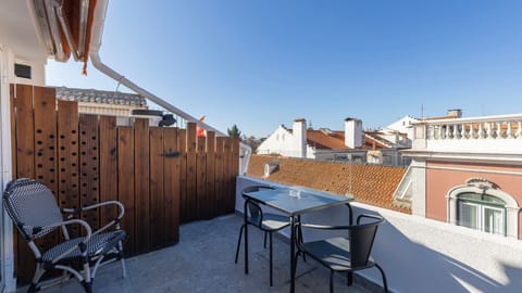 Enjoy Lisbon’s skyline on your private terrace, complete with seating for a perfect morning coffee or evening drink. #RooftopViews #OutdoorLiving