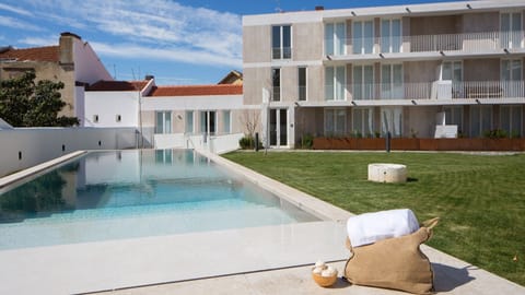 Take a refreshing dip in the swimming pool, offering a tranquil escape from the hustle and bustle of the city. #pool #airbnb #pt #lisbon