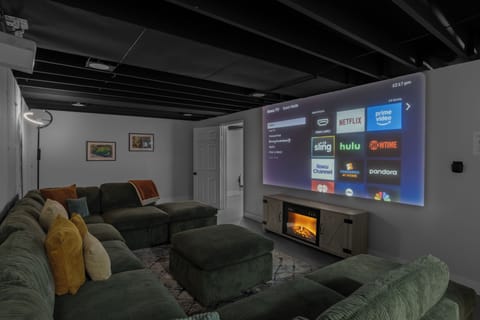 2nd Living area with ROKU projector with LED Fireplace Spaceheater