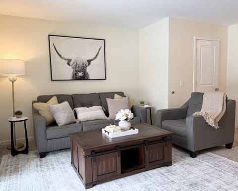 Living room comfort with cozy seating and fireplace vibes on screen