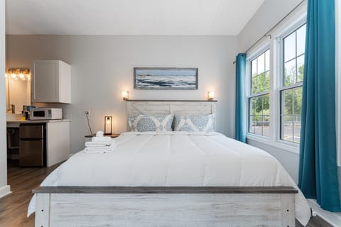 Cozy Ocean-Side King Suite (441) | Desk, laptop workspace, blackout drapes, iron/ironing board