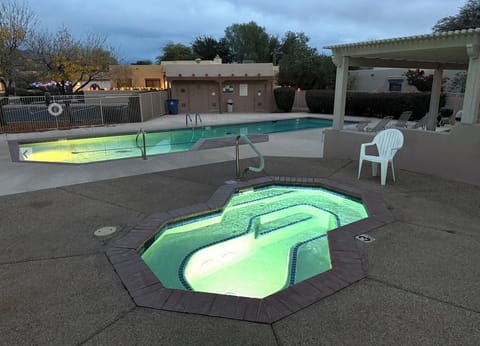 Nightime view of the community hot tub and lap pool (pool is not heated)