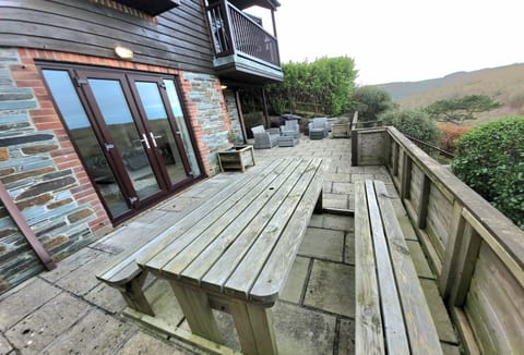 Langunnett Cottage, Looe: Terrace with beautiful views over the countryside, Looe estuary and woodlands