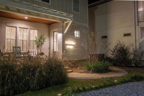 The front of the house has two parking spots and a beautiful patio from which various annual parades can be viewed.