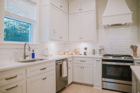 Kitchen drawers are fully stocked with cutlery and cookware. Special items include All-Clad professional pots and pans, InstaPot pressure cooker, waffle iron, full baking set, oven-to-table dishes, serving ware, tea set and coffee station.