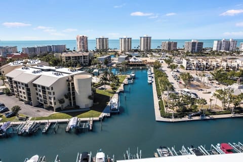 Soak in the coastal lifestyle with sweeping water views, boats below, and the Gulf just minutes away.