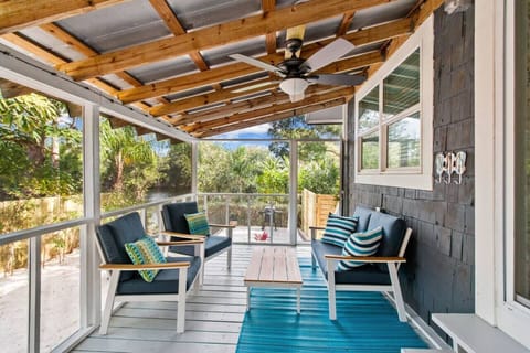 Back Porch | Enjoy hanging out with friends and family on the back screened in patio!