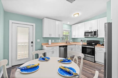 Kitchen | Bright & airy renovated kitchen complete with butcher block countertops!