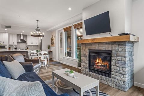 Cozy living room with a TV,  fireplace, and sofa bed to watch your favorite movies.