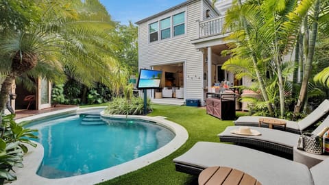 CASA DEL MONO is a stunning tropical retreat with crystal-clear pool nestled among lush palms...