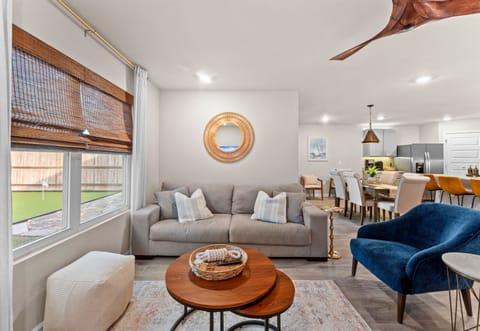 Natural light fills the space, creating a calm and inviting spot to watch TV, read, or catch up with family.