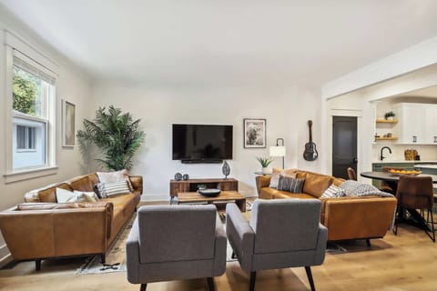 Living Room | Open Concept Seating Area with TV | First Floor | Unit B