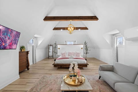 Bedroom 1: A roomy, girly bedroom with a plush king-size bed for ultimate comfort.