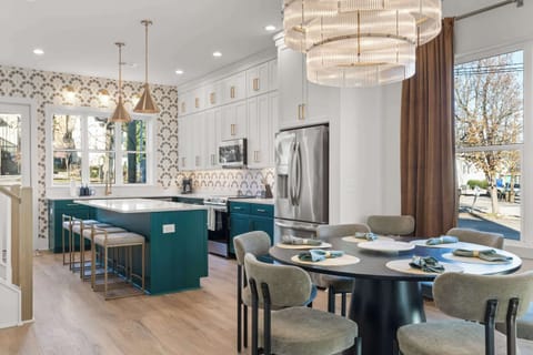 Thoughtfully designed main level with a spacious dining area and elegant chandelier, perfect for shared meals and celebrations.