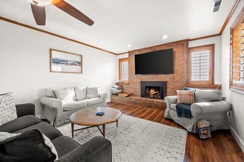Gather around the fireplace in the main lounge with seating for everyone.