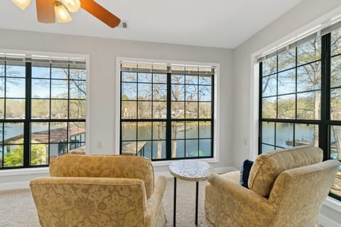 Bright and spacious sunroom with views of the lake