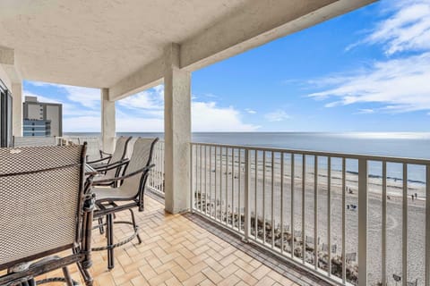Top-unit beachfront balcony with sweeping Gulf views, ocean breezes, and sunsets