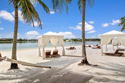 The private white-sand beach of Lake Cuomo, Miromar's 700-acre freshwater lake.