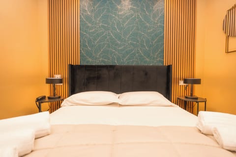 Family Quadruple Room, City View | In-room safe, desk, laptop workspace, soundproofing