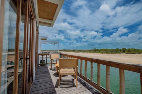 Sip morning coffee while the lagoon glitters below.