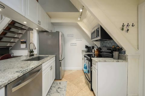 Fully equipped kitchen with modern appliances.