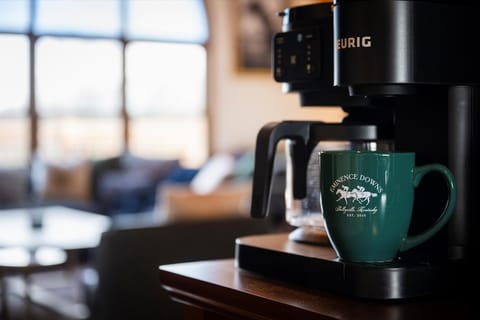 Curated coffee station with stone walls and quiet sunrise views