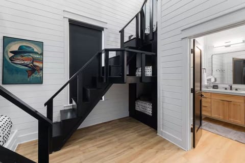 Lofted Bunk Room: Playful space with fun decor and stairs leading to a hidden retreat!