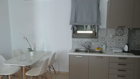 Family Apartment, 2 Bedrooms | Private kitchen | Full-size fridge, oven, stovetop, coffee/tea maker